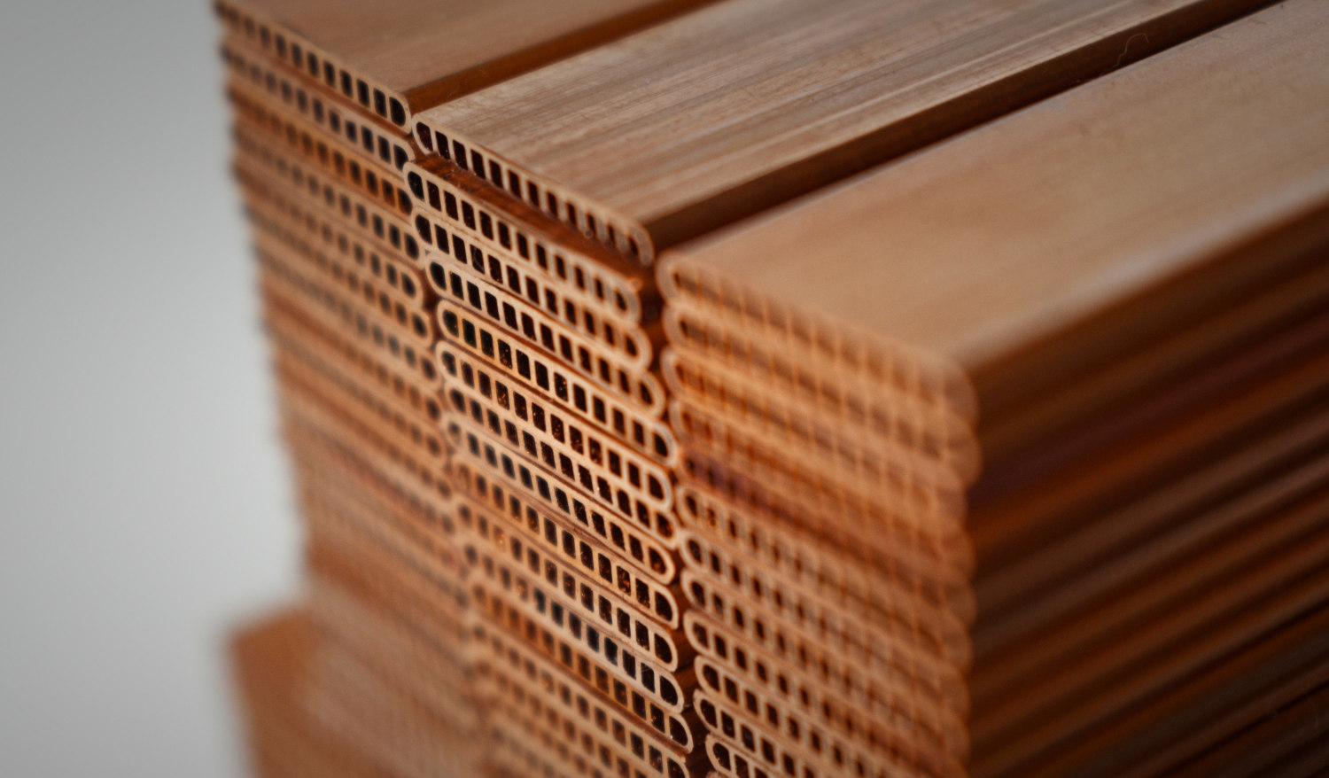 closeup of profile of extruded copper tube batch